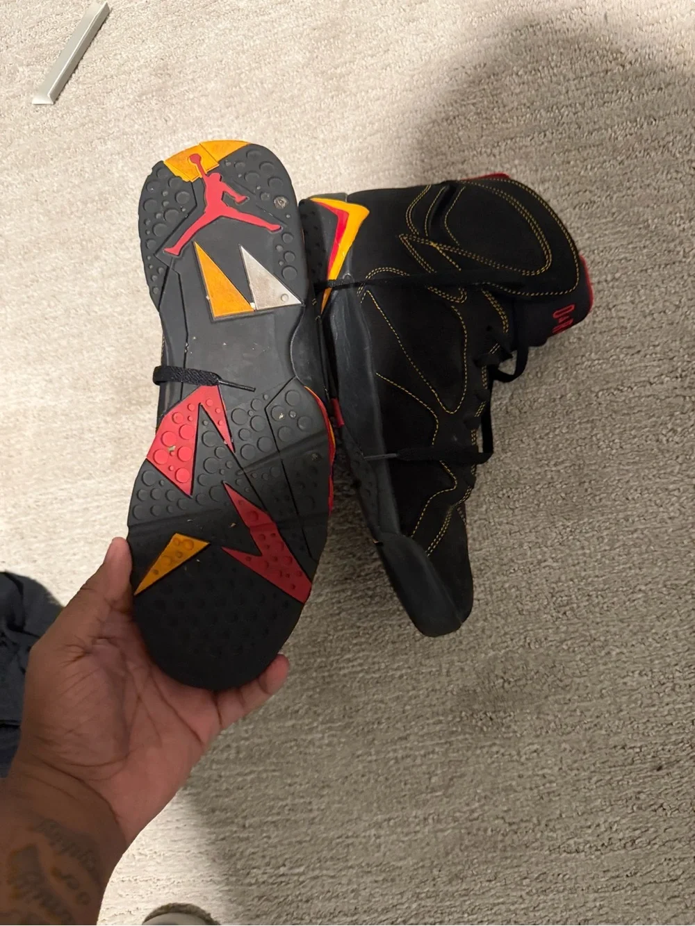 Jordan Black Sneakers with Red Pull Tabs and Yellow Accents